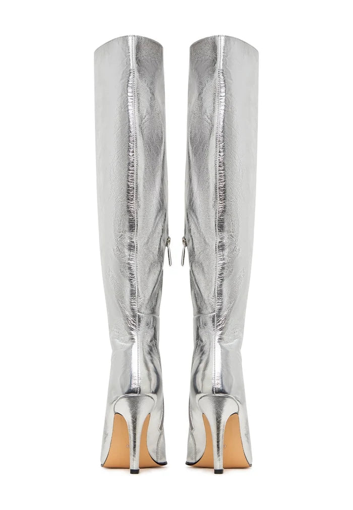 A stylish pair of silver knee-high high heel boots, offering trendy statement metallic footwear for an elegant look.