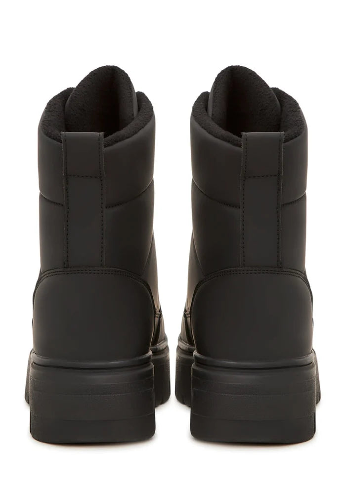 A stylish pair of elegant black snow boots, perfect for winter, with a fashionable and sleek design.
