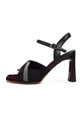 A pair of stylish and upscale black sandals with an elegant design, perfect for any formal occasion.