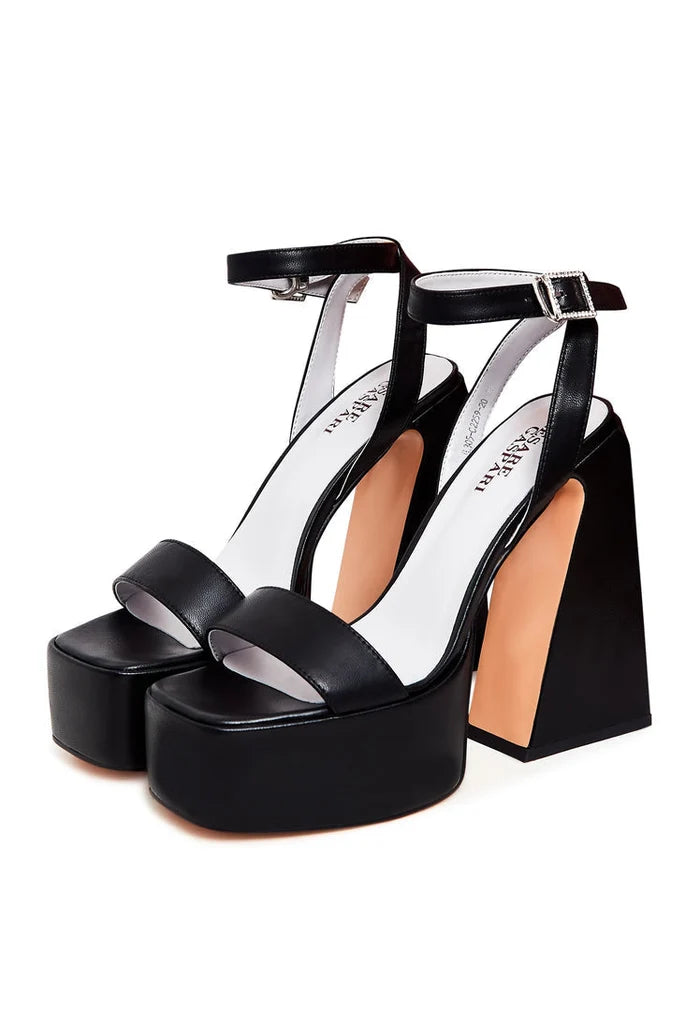 A stylish and sophisticated pair of elegant black sandals with an elevated design. Perfect for a chic and classy look.
