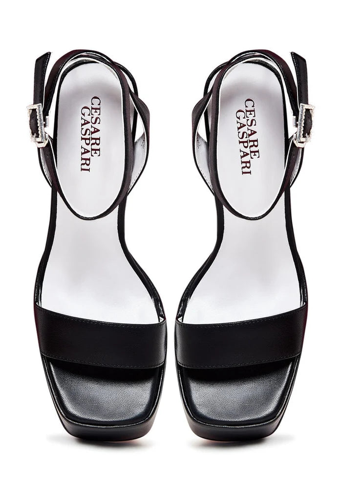 A stylish pair of elevated black sandals, perfect for adding a touch of elegance to any outfit.