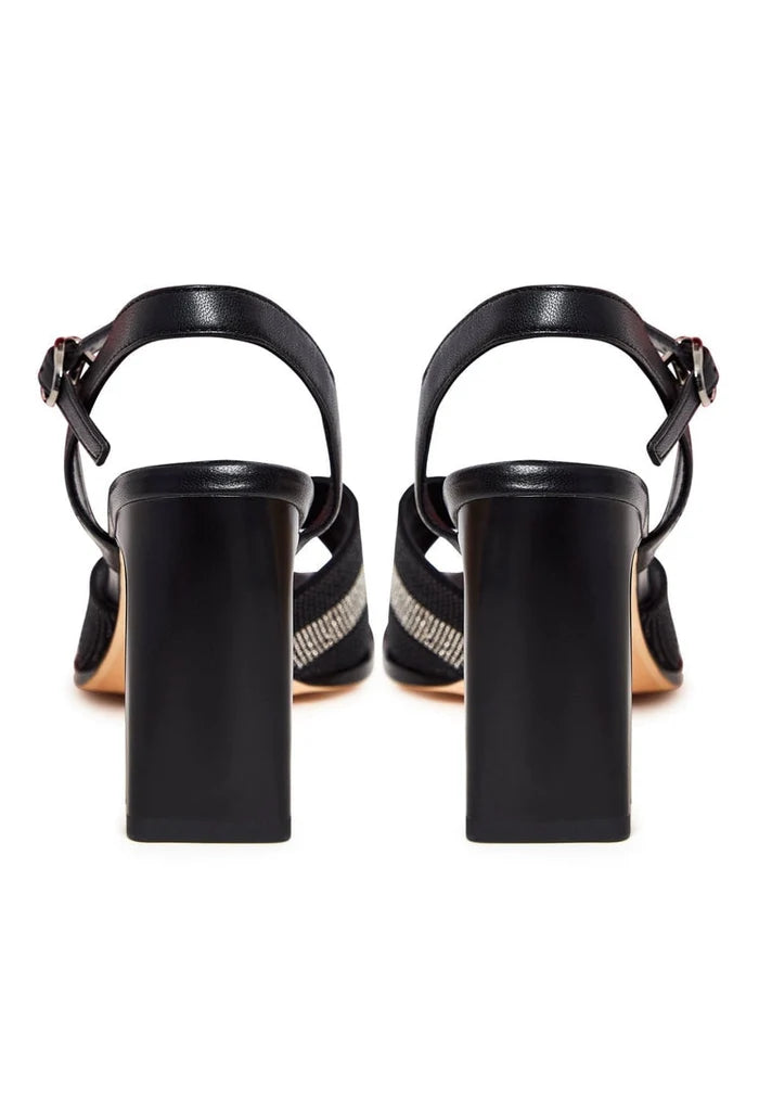 A pair of elegant black elevated sandals featuring a chic design.