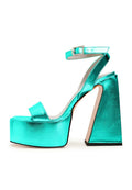 A pair of luxurious green sandals, the epitome of elevated elegance in designer footwear fashion.