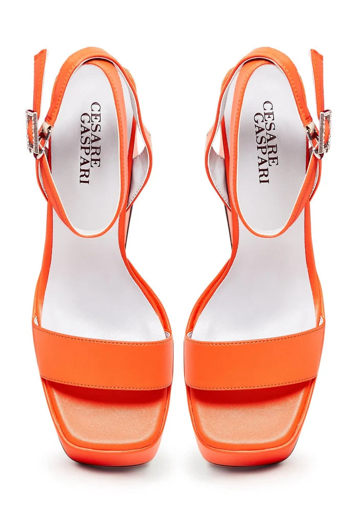 A stylish pair of sophisticated orange high heel sandals, the perfect elegant footwear for women's fashion.