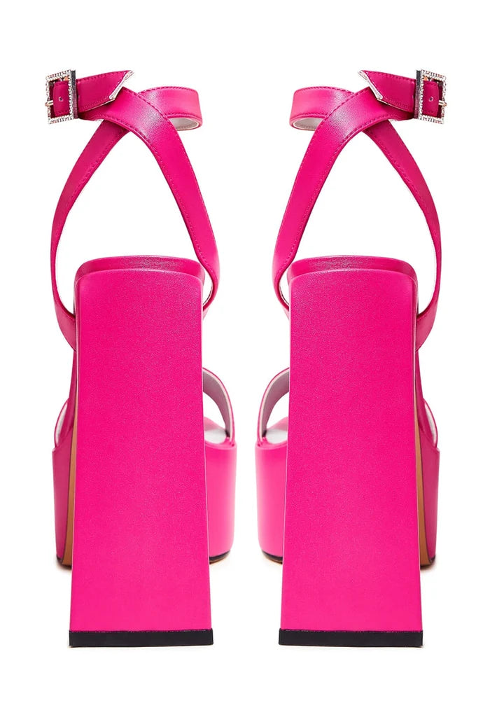 A pair of stylish women's pink sandals, perfect for summer days with their elevated elegance.