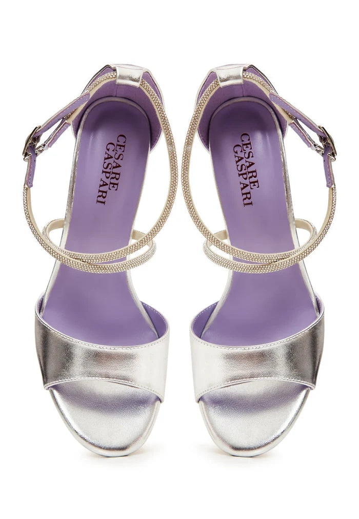 Elevated elegance in silver! Shop our stunning silver elegance sandals for sale - the perfect accessory for any glamorous look.