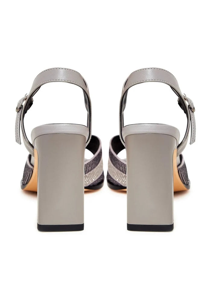 A pair of stunning silver elegance sandals for sale, showcasing elevated style and sophistication.