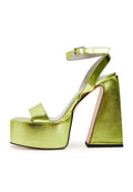 A pair of elegant yellow sandals, perfect for stylish women's fashion outfits, providing an elevated and chic footwear option.