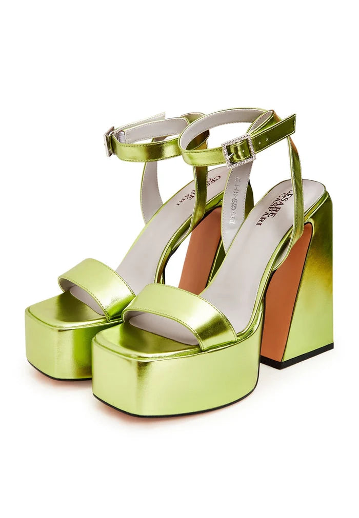 A pair of stylish and elegant yellow sandals - the perfect elevated footwear for women's fashion.