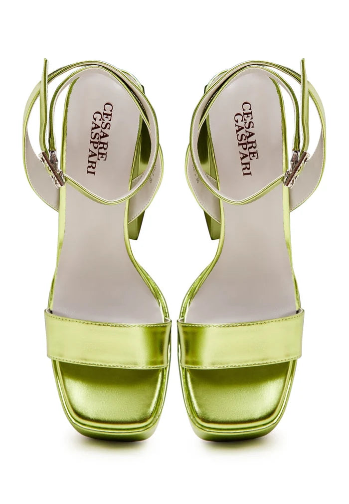 A pair of elegant yellow sandals, perfect for elevated footwear and stylish women's fashion shoes.