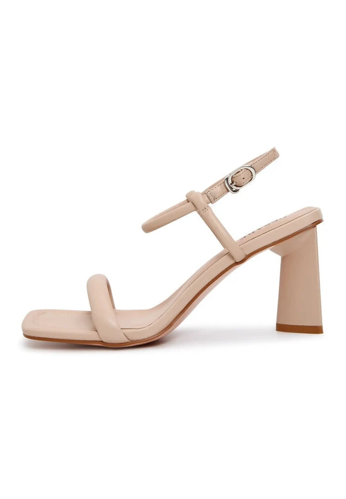 Beige shoes with an elegant design, perfect for women looking for stylish heels that elevate their look with high-end designer footwear.