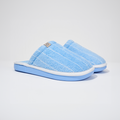 Angled view of Essential Cabana striped terry slipper showcasing blue and white cotton terry upper and blue EVA sole on white background