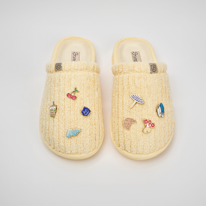 Top-down view of Limoncello Essential ribbed terry slippers showcasing magnetic charms on white background