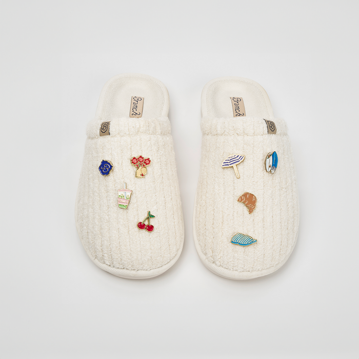 Overhead view of Essential Panna ribbed terry slipper showcasing ribbed terry texture and magnetic charm pins on a white background