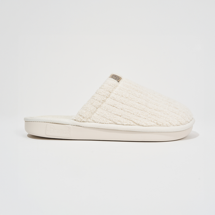 Side view of Essential slipper showcasing ribbed terry upper and branded rubber sole on white background