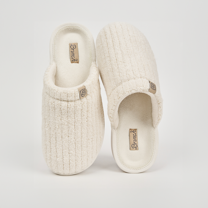 Top view of Panna Essential slippers showing ribbed terry texture, plush footbed, and Brunch logo tags on white background