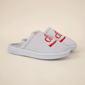 Angled view of grey Diet Coke collab slippers with red embroidered logo, faux shearling lining and molded sole