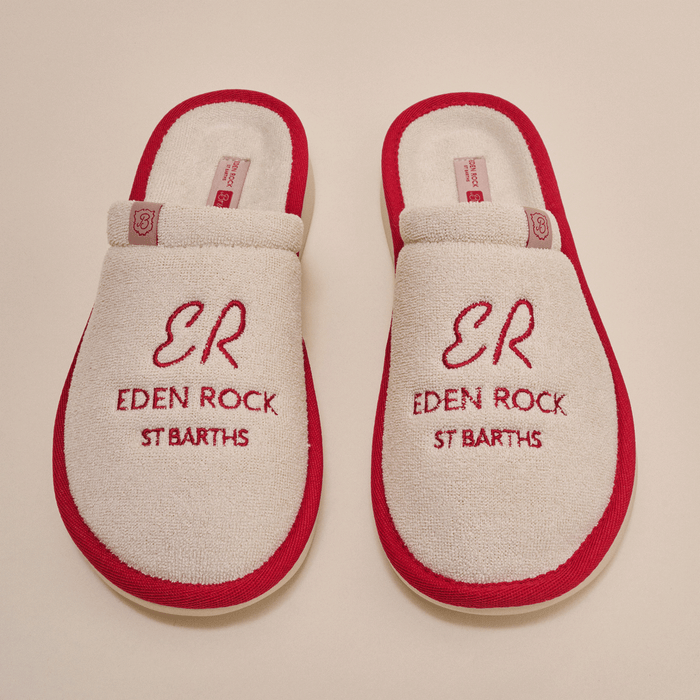 Overhead view of beige terry Eden Rock slippers with red trim showing red embroidered ER Eden Rock St Barths on top