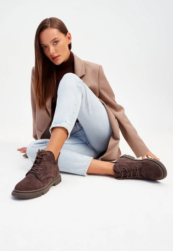 A pair of trendy, stylish flat sole ankle boots, perfect for casual comfort and everyday wear.