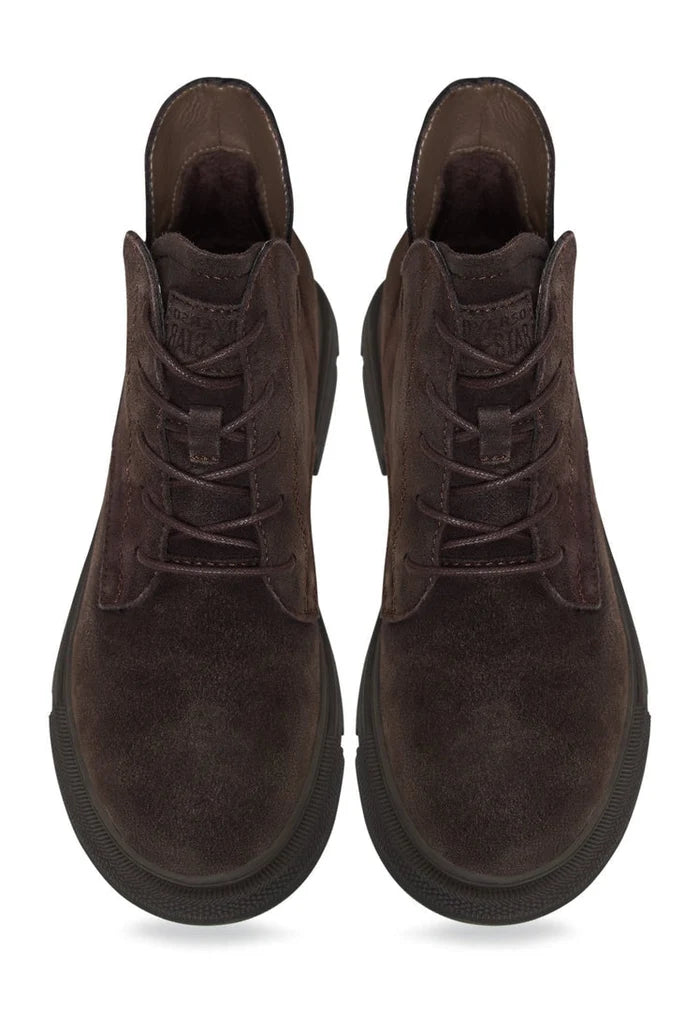 A pair of stylish and comfortable flat sole ankle boots, perfect for a casual and trendy look.