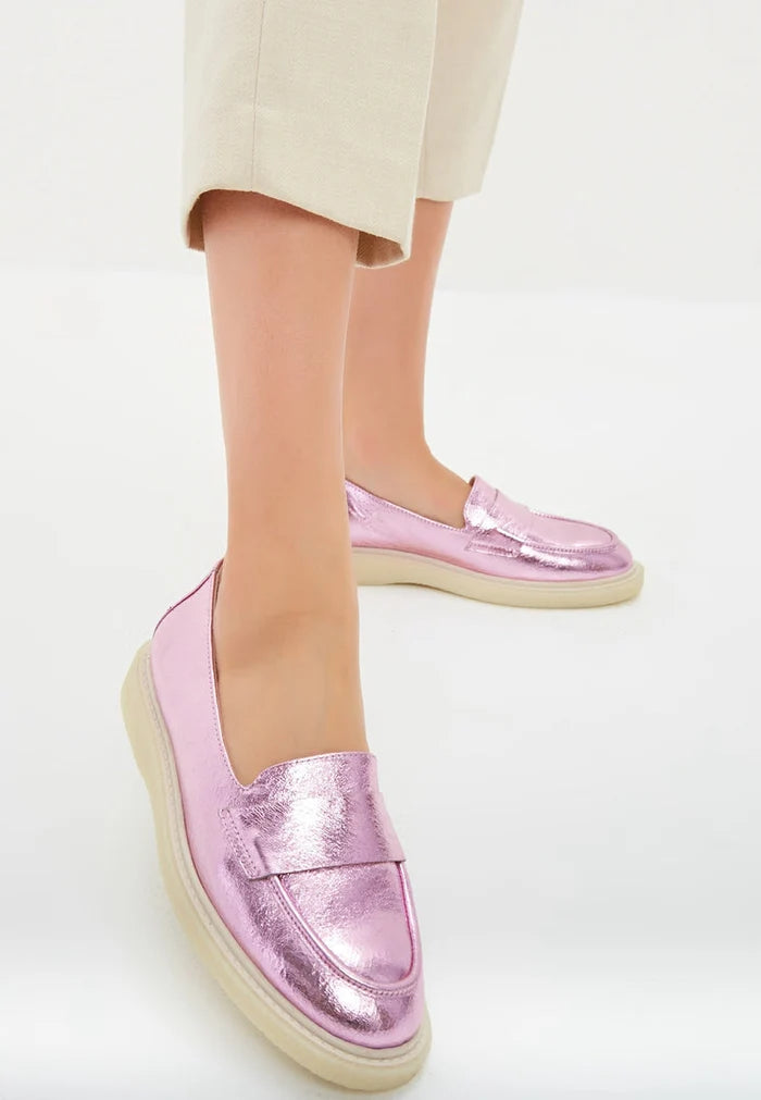 Stylish metallic pink flat sole loafers, a trendy choice for women's fashionable footwear.