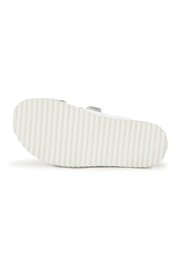 A stylish pair of women's white Meredith mules with a flat sole, perfect for summer sandals.