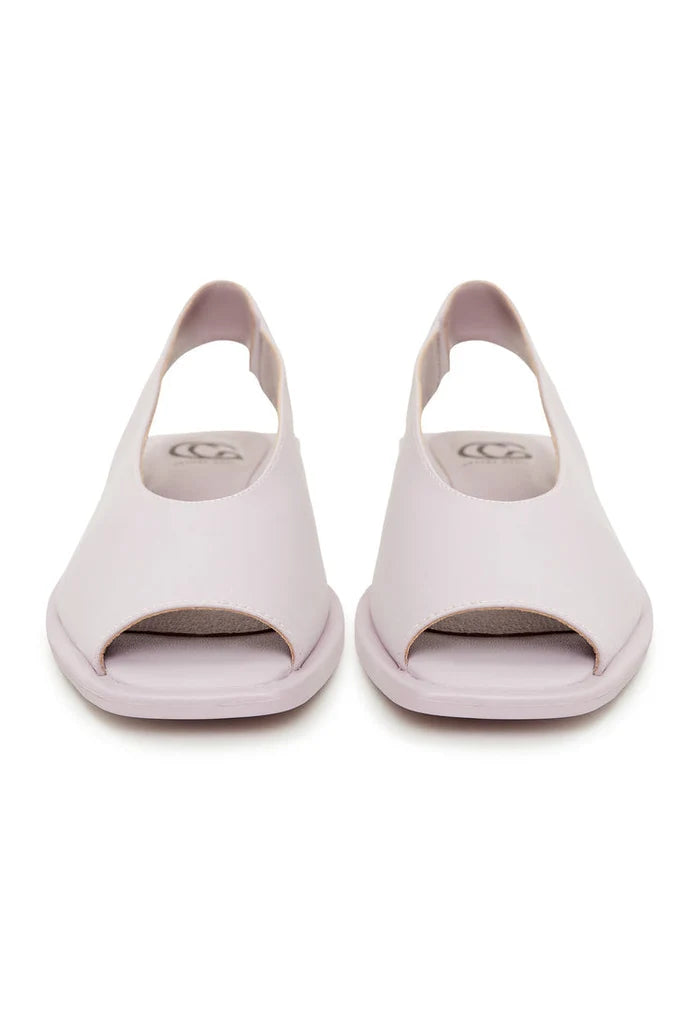 A pair of stylish flat sole violet women's sandals, perfect for summer and beach wear.