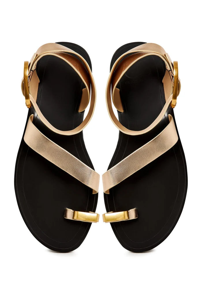 A close-up image of Paula flat sole gold sandals, perfect for women looking for stylish and casual footwear.