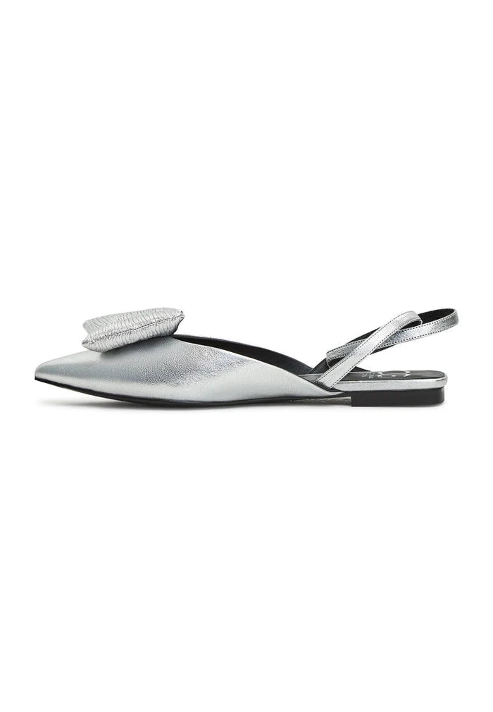 A close-up of silver flat sole slingback ballerina shoes by Gabriela, perfect for women looking for stylish and comfortable footwear.