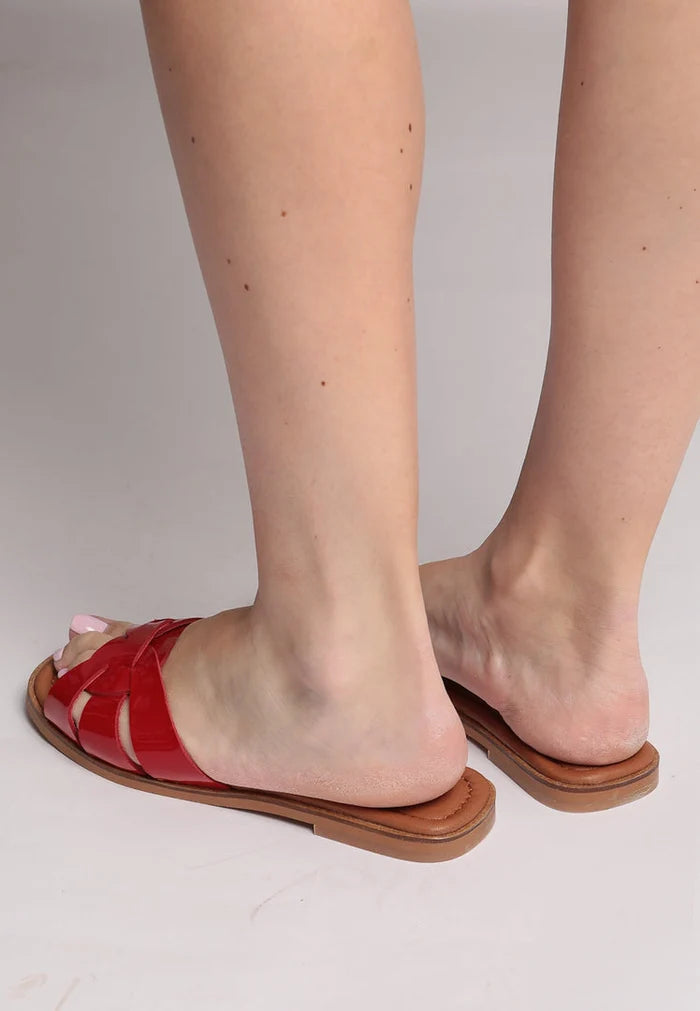 A stylish pair of women's red gloss weave slide sandals, perfect for the summer.