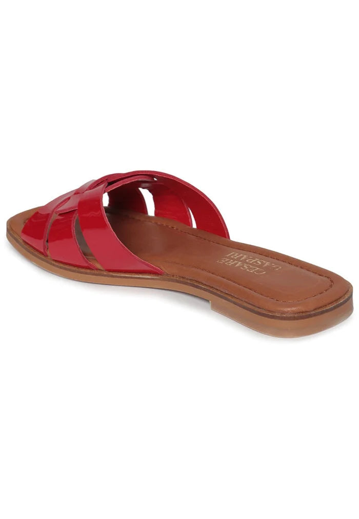 A stylish pair of red weave slide sandals, perfect for summer.