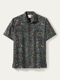 Dark multicolor leaf and floral print cotton Hawaiian shirt, flat lay on white background (Image 1 & 2).
