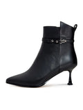 A pair of fashionable high-heeled leather ankle boots for women, featuring stylish leather booties perfect for any trendy look.