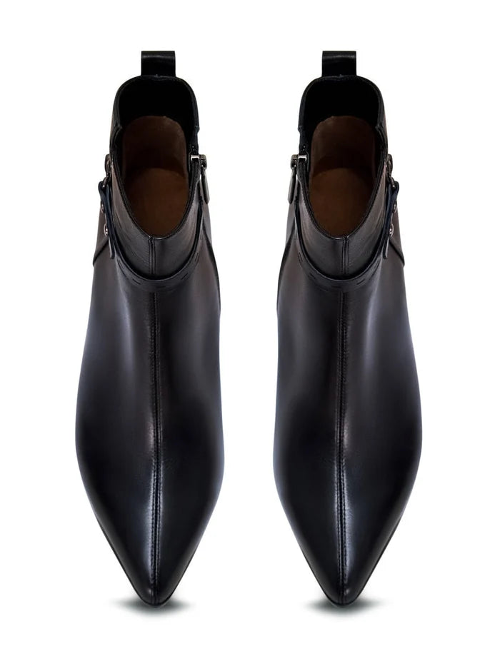 A close-up image of fashionable high-heeled leather ankle boots, a stylish choice in women's heeled boots and leather booties.