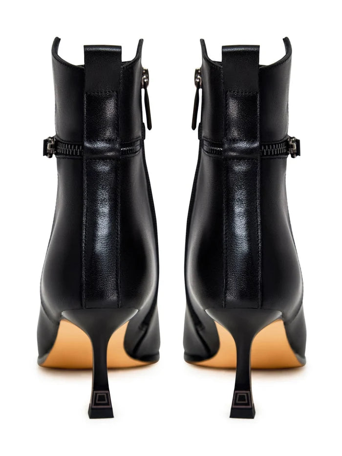 A stylish pair of high-heeled leather ankle boots for women, perfect for a fashionable look with these leather booties.