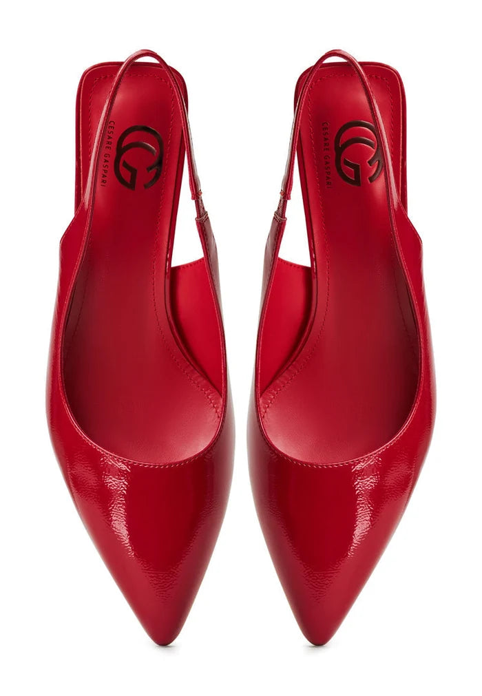 A stylish pair of red high heeled pumps known as Harper red pumps for women, perfect for adding a pop of color to any outfit with their on-trend red heels.