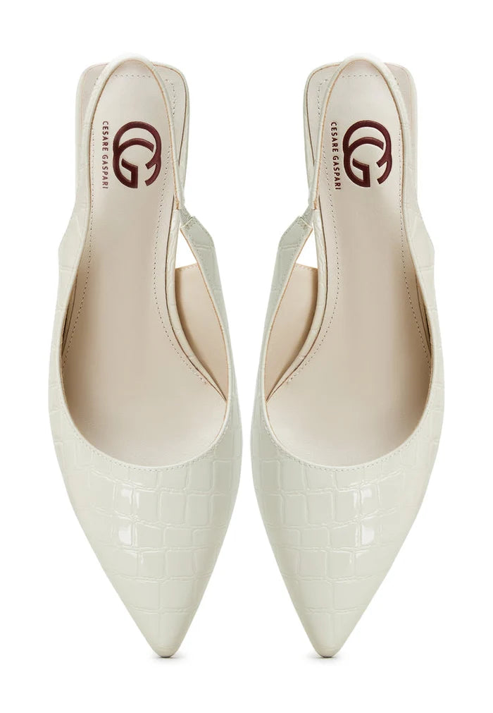 A pair of stylish white Harper pumps high heeled shoes, a fashionable choice in women's footwear for any occasion.