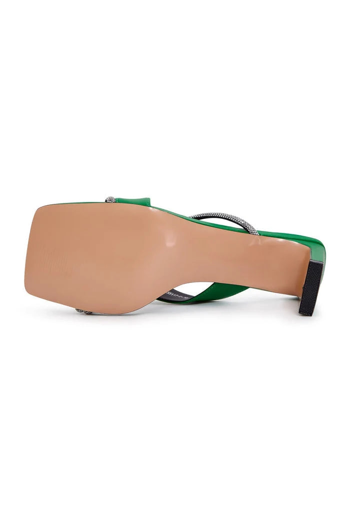 A pair of stylish women's green high heels strappy sandals, perfect for adding a fashionable touch to any outfit.