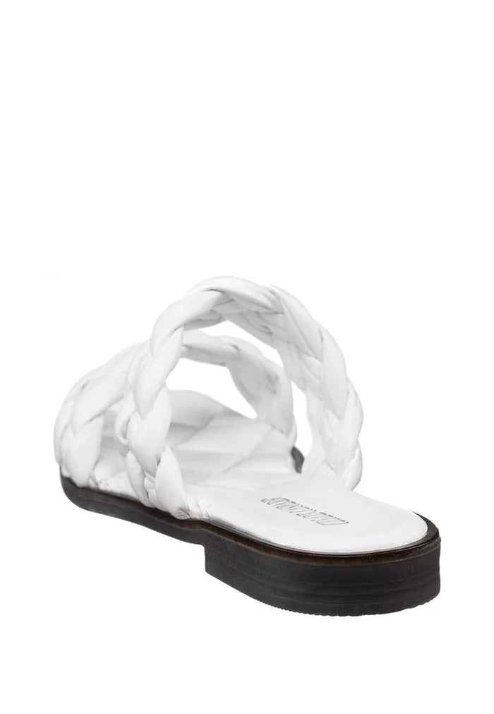 A pair of soft leather flat sole white sandals, crafted with high quality materials for a stylish and comfortable look.