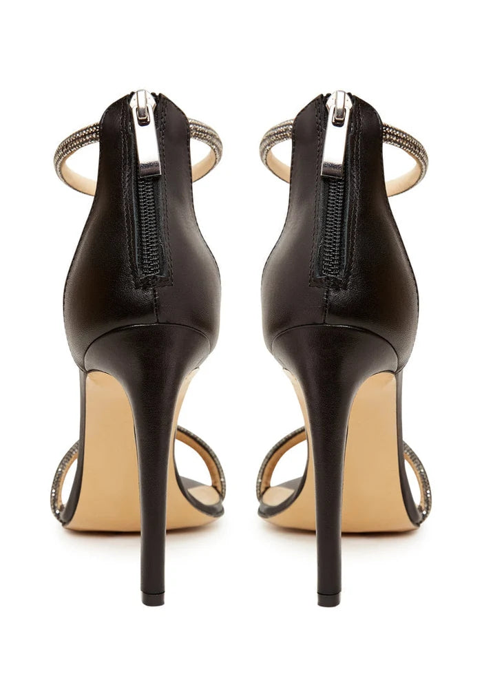A stylish pair of black high heel sandals with jewel embellishments, perfect for women looking for fashionable and elegant footwear.