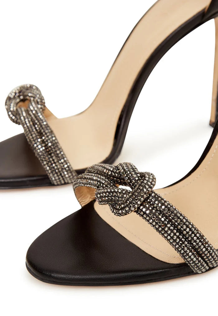 A stylish pair of black high heel sandals with jewel embellishments, perfect for women looking for elegant and fashionable footwear.