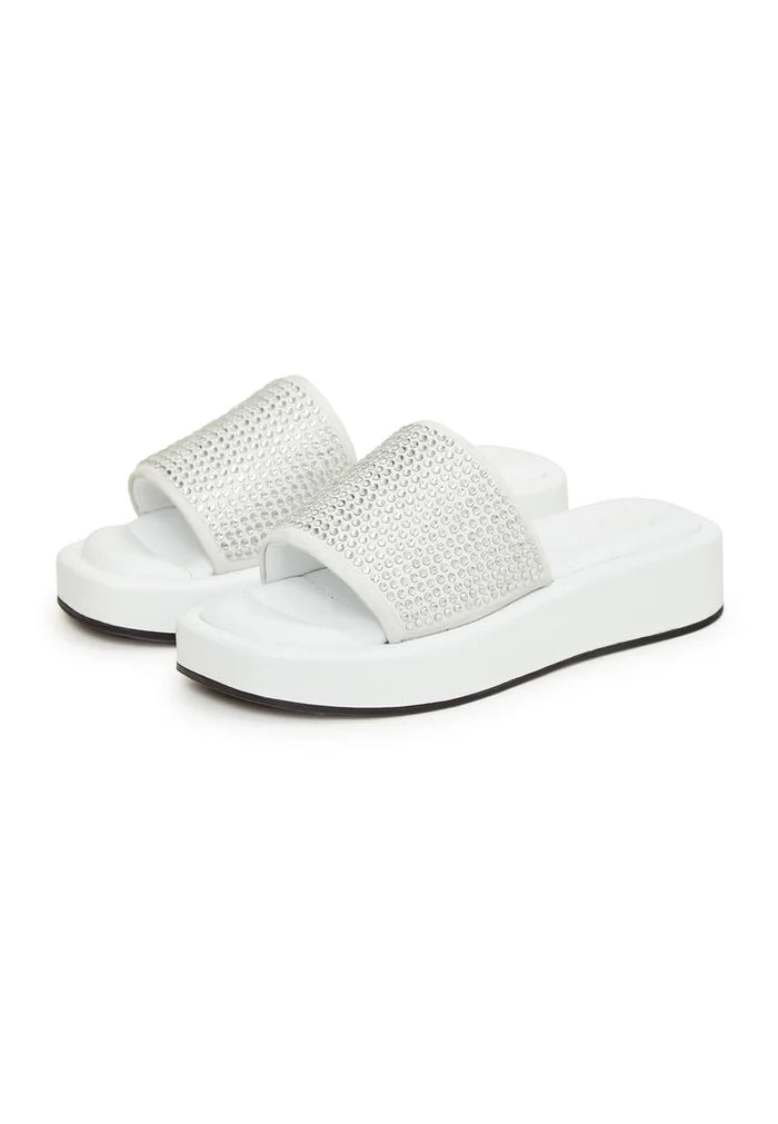 A trendy pair of white platform mule sandals with jewel embellishments, perfect for the fashion-forward woman looking for high heel platform shoes.