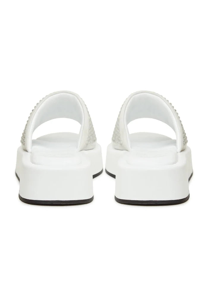 A stylish pair of white platform mule sandals with jewel embellishments, perfect for the fashion-forward woman looking for high heel platform shoes.