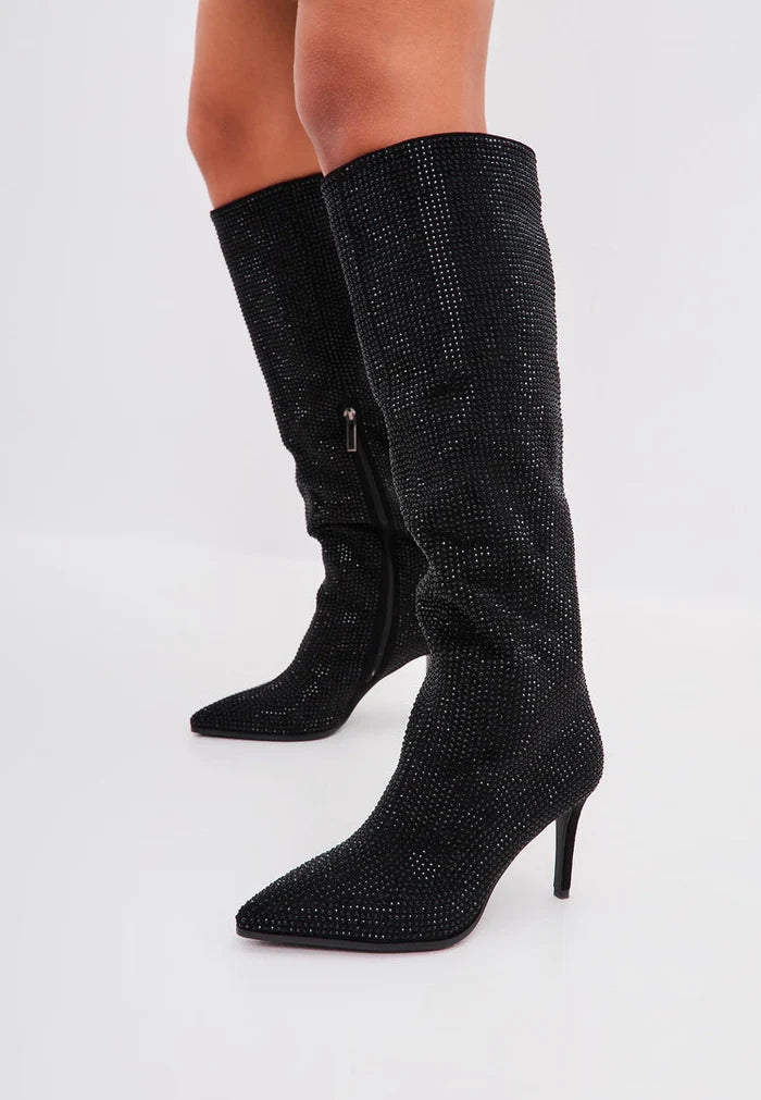 A trendy pair of Mili Black Jewel Stiletto Knee High Boots, perfect for any fashion-forward woman's wardrobe.
