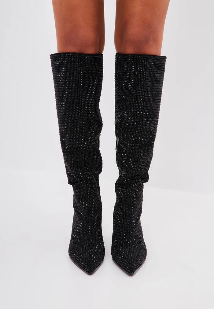 A pair of fashionable knee-high women's stiletto boots in black, featuring jewel embellishments, known as the Mili Black Boots.