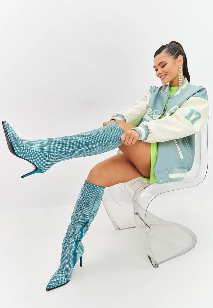 A pair of stunning blue Mili jewel stiletto knee high boots with elegant stiletto heels.