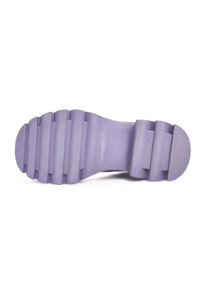 A pair of chunky sole knee-high lilac boots, the perfect addition to any women's fashion wardrobe for trendy footwear looks.