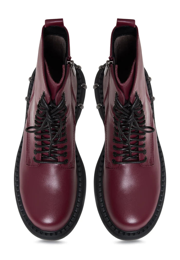 A stylish pair of Bordeaux lace-up combat boots with a chunky sole, perfect for women's fashion footwear.
