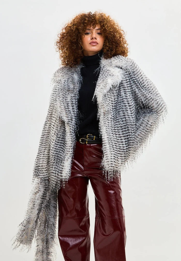 A luxurious short faux fur coat in grey, known as the stylish Monica coat.