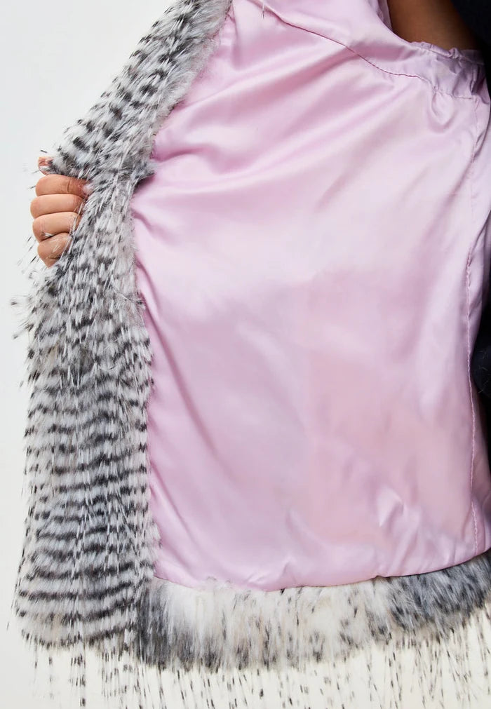 Stay cozy and stylish with this luxurious faux fur Monica coat in a chic grey color, the perfect short and lavish coat for winter.